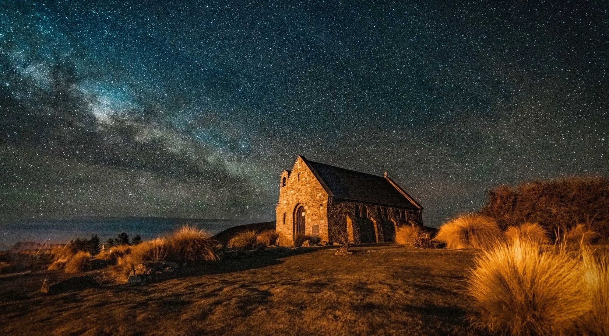 The Church of the Good Shepherd under the Milky Way with golden tussock at Lake Tekapo