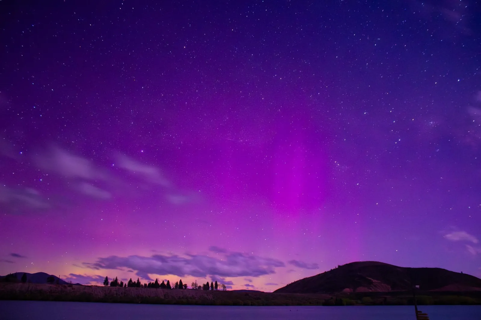 Purple aurora australis over the hills near Twizel