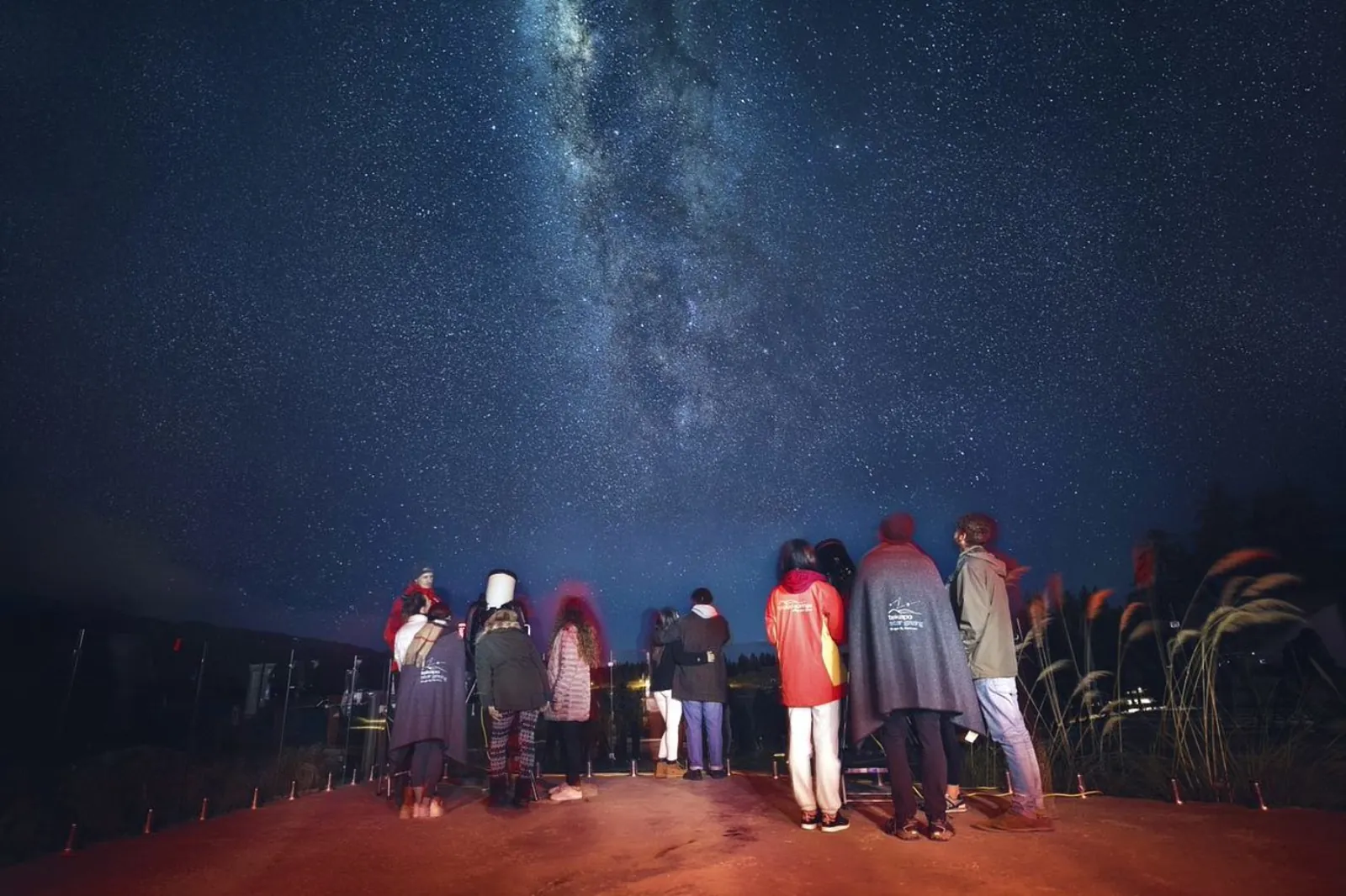 Stargazing group standing under the Milky Way at Tekapo Springs