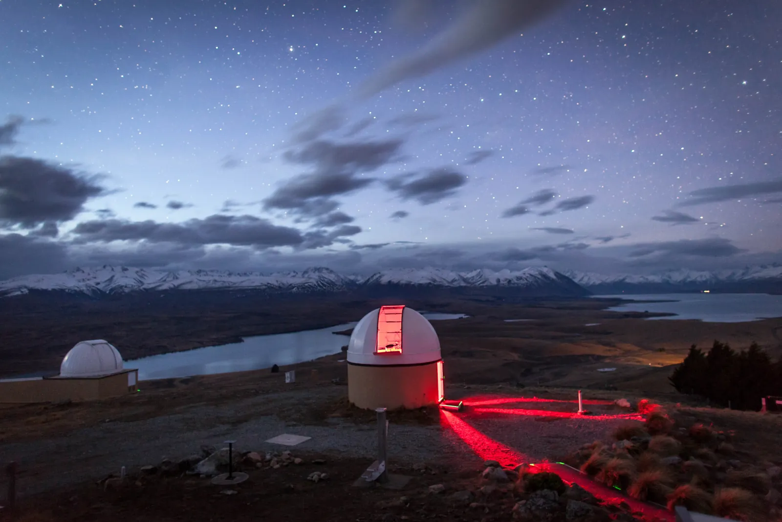 Mount John Observatory building with the Mackenzie Basin behind at twilight
