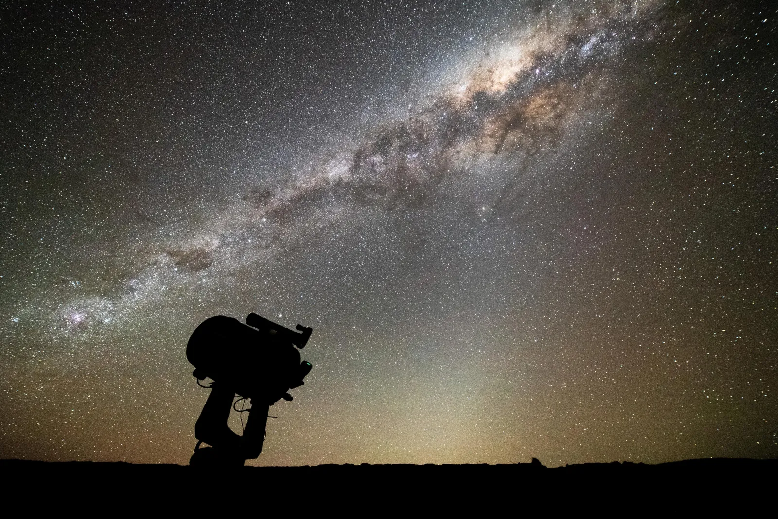 Large telescope silhouetted under the Milky Way at Silver River's Tekapo site